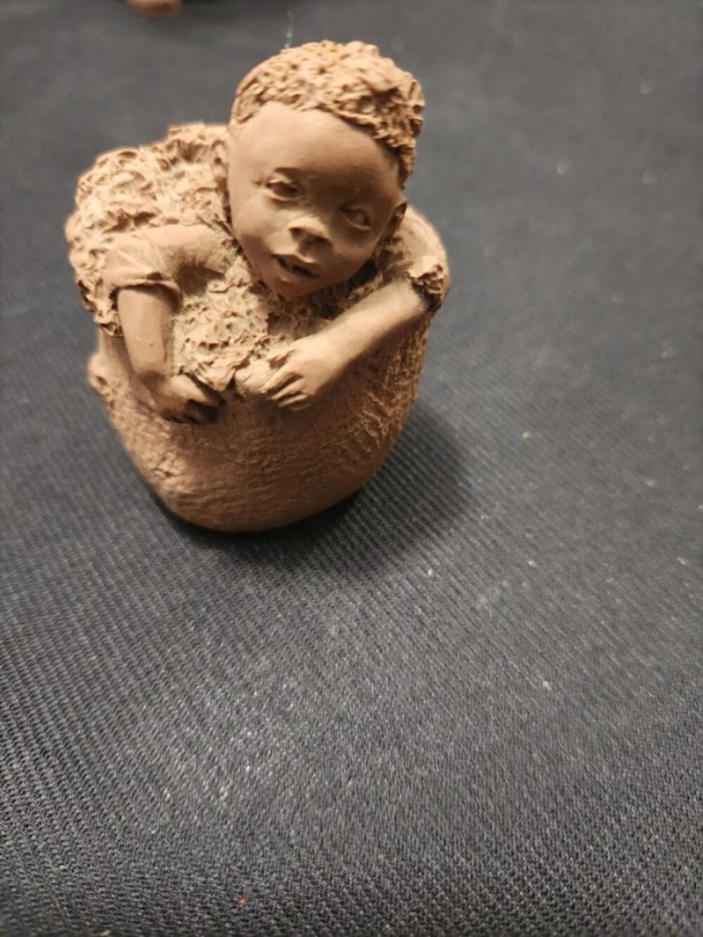 "Baby Boy in a Basket" from the 1991 TnT folk art series.